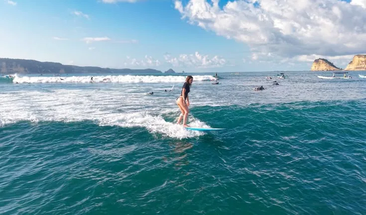 Longboard surfing Lombok, Indonesia